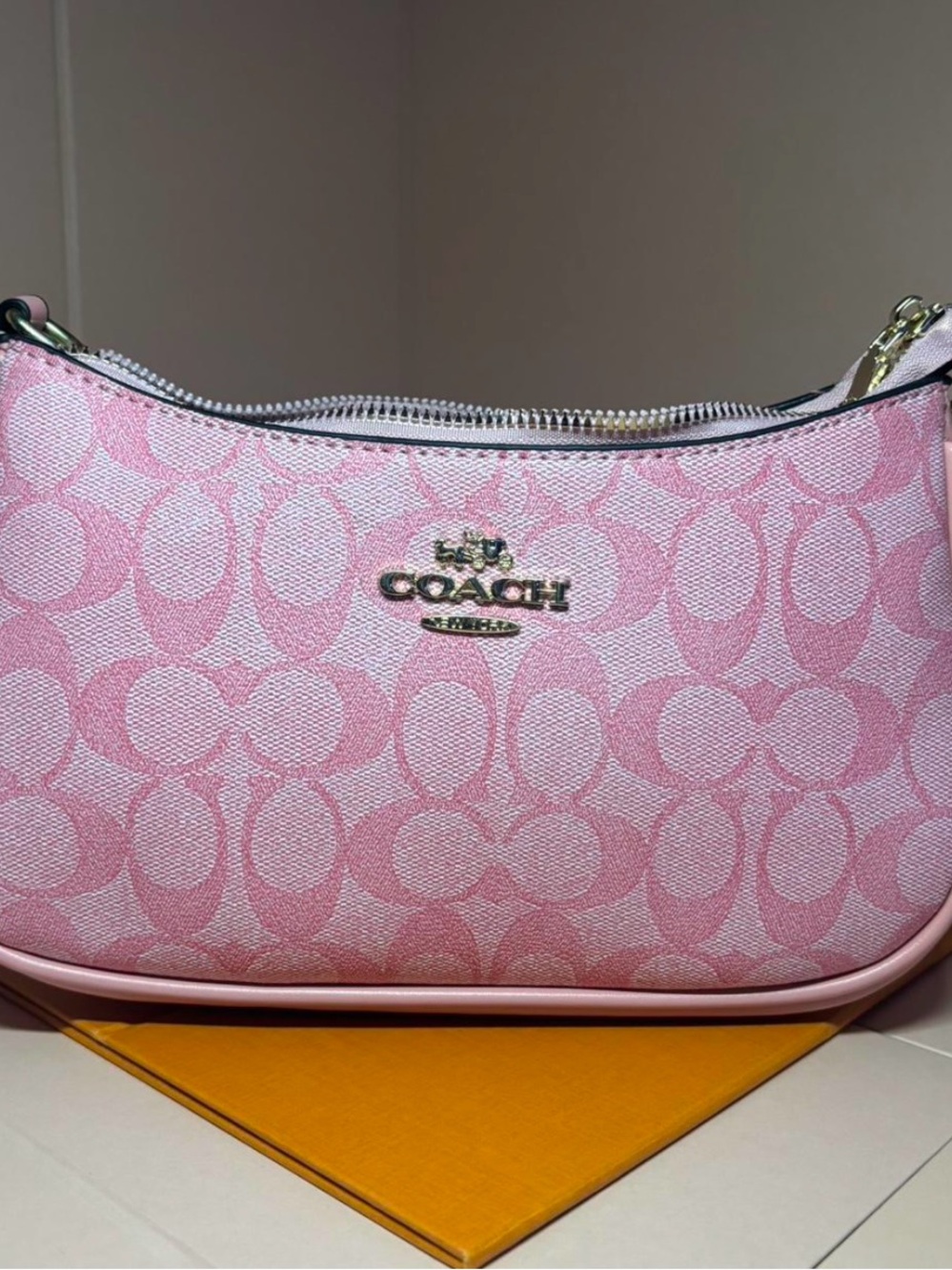 Pink shoulder bag with gold hardware